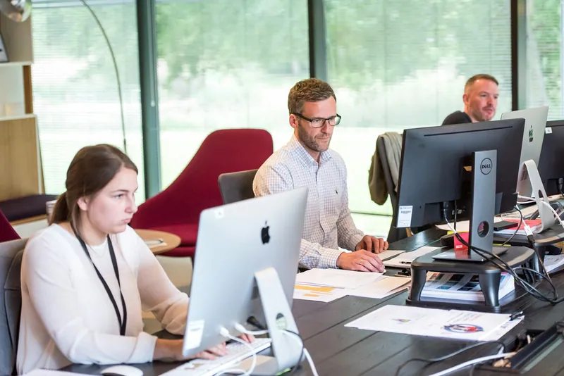 An operations team at work at their desks