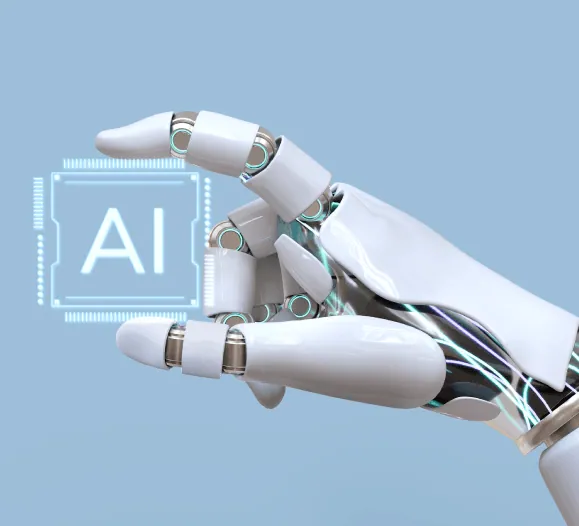 A robotic hand beside an AI chip