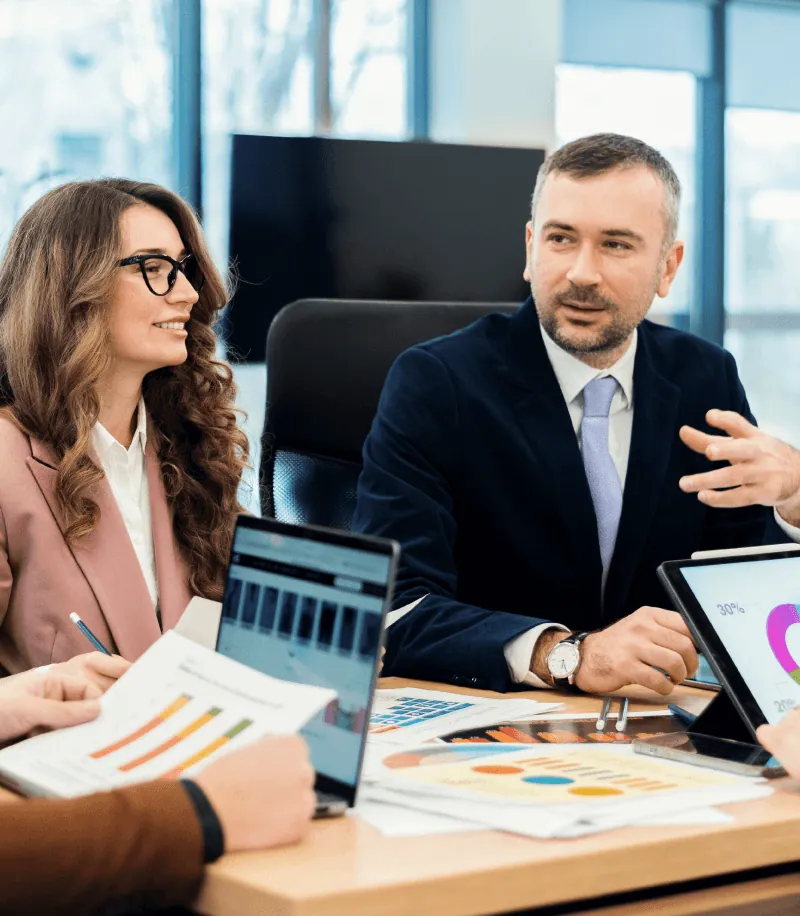 A travel business team reviewing growth figures in a meeting